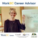 WorkBC Career Advisor Waving and Smiling by a white board