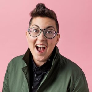 headshot of smiling excited glasses-wearing Leah Gregg