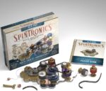 box of spintronics game with gears and circuit building materials on a table